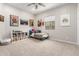 A bedroom features decor and a ceiling fan at 11818 W Luxton Ln, Avondale, AZ 85323