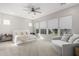Bedroom featuring large windows, neutral decor, and a cozy sitting area at 11818 W Luxton Ln, Avondale, AZ 85323