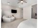 Bedroom featuring a seating area and a TV mounted on the wall at 11818 W Luxton Ln, Avondale, AZ 85323