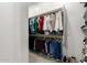 Organized walk-in closet with hanging racks and shelving, perfect for storage and organization at 11818 W Luxton Ln, Avondale, AZ 85323