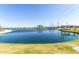 Expansive view of the community lake surrounded by walking paths and recreational areas at 11818 W Luxton Ln, Avondale, AZ 85323