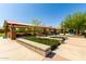 Community park with shaded seating area, landscaping, and playground enhance outdoor living at 11818 W Luxton Ln, Avondale, AZ 85323