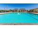 Beautiful community swimming pool with ample lounge chairs and well-maintained facilities for residents to enjoy at 11818 W Luxton Ln, Avondale, AZ 85323