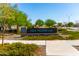 Community sign for Hay Moon Park, surrounded by lush greenery and landscaping, welcoming residents and visitors at 11818 W Luxton Ln, Avondale, AZ 85323