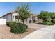 Beautiful single-story home boasts a well-manicured front yard, stone accents, and a two-car garage at 11818 W Luxton Ln, Avondale, AZ 85323