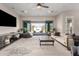 Spacious living room with backyard access through sliding glass doors to a covered patio at 11818 W Luxton Ln, Avondale, AZ 85323