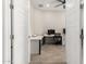 Bright office space with hard floors, a white desk, and ample natural light at 11818 W Luxton Ln, Avondale, AZ 85323