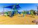 Fun community playground with slides and climbing areas under a shaded canopy at 11818 W Luxton Ln, Avondale, AZ 85323