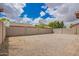 Gravel backyard enclosed by a block wall, offering privacy and a low-maintenance outdoor space at 12371 W Hadley St, Avondale, AZ 85323
