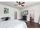 This is a bedroom view showcasing the desk area, walk-in closet, and adjacent bathroom at 12371 W Hadley St, Avondale, AZ 85323