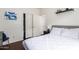 Modern bedroom with closet space, access to another room, and stylish wall decor at 12371 W Hadley St, Avondale, AZ 85323