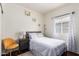 Cozy bedroom with ample natural light, a bedside table, and stylish decor at 12371 W Hadley St, Avondale, AZ 85323