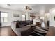 Spacious living room with modern decor, seamlessly flowing into an open-concept kitchen at 12371 W Hadley St, Avondale, AZ 85323