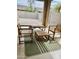 Covered patio area with outdoor furniture, perfect for relaxing and entertaining in backyard at 12371 W Hadley St, Avondale, AZ 85323