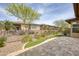 Paver patio with artificial turf and desert landscaping offers a tranquil outdoor space at 13204 W Via Dona Rd, Peoria, AZ 85383