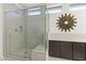 Modern bathroom with glass-enclosed shower, built-in bench, and designer tile work at 13204 W Via Dona Rd, Peoria, AZ 85383