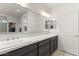 Bathroom featuring double sinks, spacious vanity, and stylish lighting fixtures at 13204 W Via Dona Rd, Peoria, AZ 85383