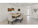 Elegant dining room with a modern table, comfortable seating, and decorative wall art at 13204 W Via Dona Rd, Peoria, AZ 85383