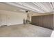Epoxy floor in garage with storage cabinets, water softener, and door to the house at 13204 W Via Dona Rd, Peoria, AZ 85383
