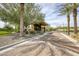 Community guard house surrounded by lush landscaping at 13204 W Via Dona Rd, Peoria, AZ 85383