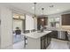 Bright kitchen with island seating and patio access for indoor outdoor living at 13204 W Via Dona Rd, Peoria, AZ 85383