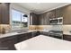 This is a kitchen with a large sink and view to the outside world at 13204 W Via Dona Rd, Peoria, AZ 85383