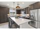 Well-equipped kitchen with a spacious island, stainless steel appliances, and ample storage at 13204 W Via Dona Rd, Peoria, AZ 85383