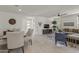 Spacious open-concept living area with modern furnishings, tile flooring, and abundant natural light at 13204 W Via Dona Rd, Peoria, AZ 85383