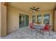 Charming patio with overhead fan and a table set for two at 13204 W Via Dona Rd, Peoria, AZ 85383