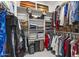 Well-organized walk-in closet with ample shelving and hanging space for clothes at 13204 W Via Dona Rd, Peoria, AZ 85383