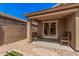 Backyard featuring a covered patio with outdoor seating at 15573 W Laurel Ln, Surprise, AZ 85379