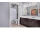 Bathroom featuring gray walls, tile flooring, vanity and shower with curtain at 15573 W Laurel Ln, Surprise, AZ 85379
