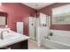 Bathroom features a shower, a bathtub and a vanity at 15573 W Laurel Ln, Surprise, AZ 85379
