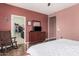 Bedroom features a walk-in closet, tile flooring and neutral paint at 15573 W Laurel Ln, Surprise, AZ 85379