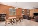 Inviting dining area with a chandelier, a decorative hutch, and access to the living room at 15573 W Laurel Ln, Surprise, AZ 85379