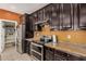 View of the kitchen showcasing stainless steel appliances and granite counters at 15573 W Laurel Ln, Surprise, AZ 85379