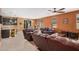 Cozy living room with tile flooring, an open layout, and access to the backyard at 15573 W Laurel Ln, Surprise, AZ 85379