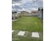 Spacious backyard with lawn and hardscape features at 1740 W Crescent Ave, Mesa, AZ 85202
