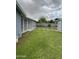 Expansive backyard with lush grass, shed, and patio for outdoor living at 1740 W Crescent Ave, Mesa, AZ 85202