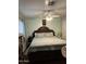 Comfortable bedroom with a large bed, soft linens, and ample space for relaxation at 1740 W Crescent Ave, Mesa, AZ 85202