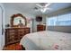 Cozy bedroom with light-colored walls, wood floors, and a decorative vanity with a large mirror at 1740 W Crescent Ave, Mesa, AZ 85202