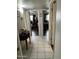 Tiled hallway that provides entry to two bedrooms at 1740 W Crescent Ave, Mesa, AZ 85202
