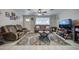 Comfortable living room with tile flooring, ceiling fan, neutral paint, and a large window for natural light at 1740 W Crescent Ave, Mesa, AZ 85202