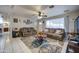 Cozy living room featuring tile flooring, ceiling fan, neutral paint, and comfortable seating at 1740 W Crescent Ave, Mesa, AZ 85202