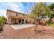 The backyard features a gravel area, patio, and a tree with hanging flowers at 17538 W Marshall Ln, Surprise, AZ 85388