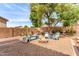 The backyard features a fire pit with colorful outdoor seating at 17538 W Marshall Ln, Surprise, AZ 85388
