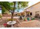 Backyard view with a basketball court, BBQ, and covered patio, perfect for outdoor entertaining at 17538 W Marshall Ln, Surprise, AZ 85388