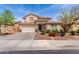 Charming two-story home featuring a well-manicured front yard and a spacious two-car garage at 17538 W Marshall Ln, Surprise, AZ 85388