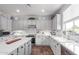 Bright kitchen with quartz countertops, white subway tile backsplash, and stainless steel appliances at 17538 W Marshall Ln, Surprise, AZ 85388