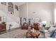 Elegant living room with high ceilings, wood flooring, and stylish decor, perfect for entertaining at 17538 W Marshall Ln, Surprise, AZ 85388